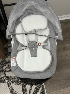 Gray Infant Rocker with White Insert and Canopy